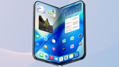Foldable tablet opened in 3D perspective, showing colorful apps and widgets on a blue wallpaper.
