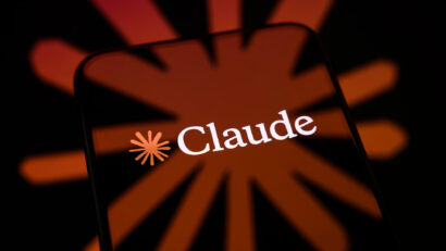 Smartphone screen showing the Claude brand name with an orange starburst background.