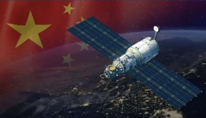 Satellite in orbit above Earth with a Chinese flag overlay, implying China’s space program or space exploration theme.